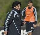 Argentina's soccer coach Diego Maradona looks to his players during a training session in Buenos Aires, Thursday. AP