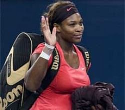 Serena Williams of the US waves after a 6-4, 3-6, 7-6 loss to Nadia Petrova of Russia at the China Open Tennis Tournament in Beijing, Thursday. AP