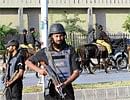 On Alert: Pakistani mounted police patrol outside army headquarters in Rawalpindi on Sunday. AFP