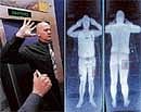 A combination of images shows an airport staff member (L) demonstrating a full body scan at Manchester Airport and computer screen showing the results