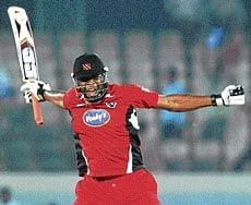 Trinidads Kieron Pollard celebrates after scoring the winning run against New South Wales in Hyderabad on Friday. PTI