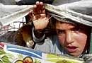 Pakistan Army troops prepare to leave for patrolling during a curfew in Bannu, a town near Waziristan on Saturday.AP