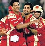 SPINNING  A WEB:  RCB captain Anil Kumble (left) celebrates with Virat Kohli after sending back a Delhi batsman. PTI