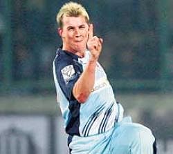 New South Wales Blues Brett Lee celebrates after dismissing Victoria Bushrangers Aiden Blizzard during the Champions League semifinal in New Delhi.
