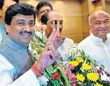 v for victorY: Maharashtra Chief Minister Ashok Chavan flashes a victory sign during his visit to the party office in Mumbai on Thursday. AFP