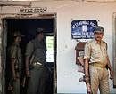 Policeman stands guard at Sankrail Police Station in West Midnapore District on Tuesday. AFP