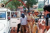 Crime: Serial killer Mohan Kumar being taken to the court in Bantwal on Thursday. dh photo