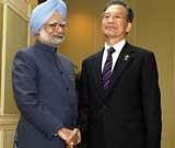 Prime Minister Manmohan Singh with his Chinese counterpart Wen Jiabao at an Indo-China bilateral talk on the sidelines of the 15th ASEAN Summit
