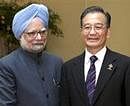Prime Minister Manmohan Singh with his Chinese counterpart Wen Jiabao during their bilateral talk on the sidelines of the 15th ASEAN Summit. PTI