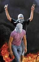 Masked Palestinian youth during clashes in the Arab neighbourhood of Ras Al Hamud in east Jerusalem, on Sunday. AP