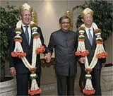 S M Krishna, (C) holds hands of his counterparts from China Yang Jiechi, (R),& Russia Sergey Lavrov before their meeting in B'lore. AP