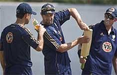 Australian cricketer Michael Hussey, right, Ben Hilfenhaus, center, and Ricky Ponting look on during a practice session in Nagpur, Tuesday. PTI