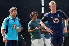Australian bowlers Brett Lee (R) and James Hopes during a practice session on the eve of third one-dayer against India in New Delhi on Friday.