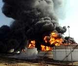 Flames and smoke rise from burning oil storage tanks at the IOC depot in Jaipur. AFP