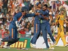 India's Dhoni (L), Harbhajan Singh (3rd L), celebrate after Australian captain Ricky Ponting (R) is run out by Ravindra Jadeja (2nd left).