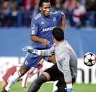 slip and slide: Chelsea's Didier Drogba gets past Atletico Madrids goalkeeper Sergio Asenjo to score his second goal during their Champions League