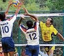 RAZOR SHARP: Ganesh Rai of KSP (right) attempts to smash past B Sunil and Rajshekar of HMT in the A Division volleyball league in Bangalore