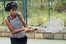 focused Shloka Kumar essays a backhand in  the AITA Talent Series tennis tournament on Thursday. DH photo