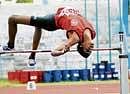 Soaring high: Harshith S  who won the boys under-18 high jump in Bangalore on Thursday. DH photo