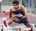 Cruise mode: Amith Yadav of Oxford College en route to the 110M hurdles gold on Saturday. DH photo
