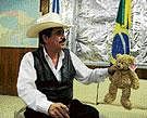 Ousted Honduran President Manuel Zelaya holds a teddy bear as he prepares to attend a press conference at the Brazilian embassy in Tegucigalpa. AFP