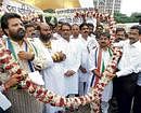 The four suspended MNS MLAs being garlanded after they disrupted the oath-taking ceremony outside the Vidhan Sabha, in Mumbai, on Monday. PTI