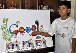 Nine year old Puru Pratap Singh with his design of Google's home page at his residence in Gurgaon on Friday. PTI