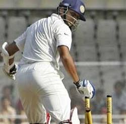 Rahul Dravid looks on as he is bowled out by Sri Lanka's Chanaka Welegedara, unseen, during the second day of their first Test cricket match in Ahmadabad on Tuesday.AP