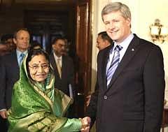Indian President Pratibha Patil, left, shakes hand with Canadian Prime Minister Stephen Harper at the Rashtrapathi Bhavan in New Delhi, on Tuesday. Harper is on an official four-day long visit to India. AP