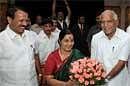 Chief Minister B S Yeddyurappa welcomes BJP leaders Sushma Swaraj, Sadananda Gowda at the core committee meeting of party's state unit, in Bangalore on Wednesday. PTI
