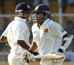 Sri Lankan cricketers Prasanna Jayawardene (L) and Mahela Jayawardene take a run during the third day of the first Test match between India and Sri Lanka at the Motera Stadium in Ahmedabad. PTI