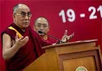 Tibetan spiritual leader the Dalai Lama addresses a function in Delhi University in New Delhi on Saturday. PTI