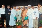 Religious leaders Sri Vidyaprasanna Theertha Swamiji, Alhaj Thoka Ahmed Musliyar and  Fr Ronny Prabhu S J inaugurating the harmony meet at Town Hall in Mangalore on Friday.