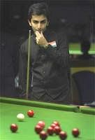 India's Pankaj Advani reacts during his round against Cyprus' Anthony Brabin, unseen, during the men's second round of the World Snooker championship in Hyderabad, Sunday. AP