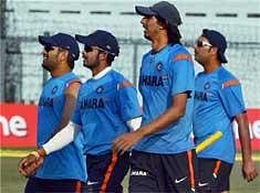 Indian cricketers (L-R) captain M S Dhoni, Srisanth, Ishant Sharma and Yuvraj Singh during a practice session ahead of the second test match between India and Sri Lanka in Kanpur on Sunday. PTI