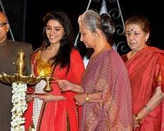Veteran actress Waheeda Rehman lighting the lamp to inaugurate the 40th International Film Festival 2009 at Kala Academy in Panaji, Goa on Monday. Union Minister of Information and Broadcasting Ambika Soni, Chief Minister of Goa Digambar V. Kamat and film actress Asin are also seen. PTI