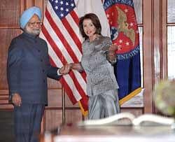Speaker of the US House of Representatives Nancy Pelosi welcomes Prime Minister Manmohan Singh to her office in the Capitol and invites him to sign the visitor's book. DH Photo: K.N. Shanthkumar