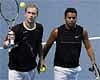 Czech Republic's Lukas Dlouhy, left, and India's Leander Paes, right, during their ATP World Tour Finals tennis match against Poland's Lukasz Kubot and Austria's Oliver Marach at the O2 Arena in London, Monday . AP