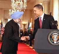 Prime Minister Manmohan Singh shakes hands with President Barack Obama during the state dinner at White House in Washington on Tuesday. PTI