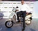 TVS Chairman Venu  Srinivasan with the bike