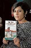 Vinita Kamte displays a book To The Last Bullet written by her in Mumbai on Tuesday. PTI