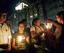 Remembrance day: People light candles at a vigil for the victims of last years militant attacks outside the Taj Mahal hotel in Mumbai on Wednesday. REUTERS