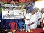 MLA Dr G Parameshwar inaugurating the Rs 1.17 crore worth road development project in the limits of Tovinakere village of Koratagere taluk in Tumkur district on Friday. Town Panchayat President A D Balaramaiah and ZP member Sudhakar Lal are also seen. DH photo