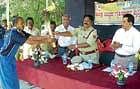 District Superintendent of Police Raveendra Prasad inaugurated the district-level Home Guards Sports Meet, by handing over the baton to national sports champion Manchabale Shrinivas, in Chikballapur on Friday. DHPHOTO