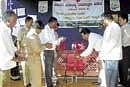 Regional Transport Officer Abdul Ahmed Khan inaugurating various competitions organised as a part of the Air Pollution Control Month at Dibbur in Chikkaballapur taluk. Principal S Byrappa, Head Master Ranganath are also seen. DH photo