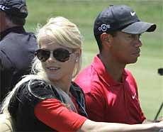 Tiger Woods was injured early Friday when he lost control of his SUV outside his Florida mansion, and a local police chief said Woods' wife  Elin Nordegren used a golf club to smash out the back window to help get him out. AP