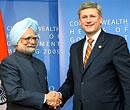 Prime Minister Manmohan Singh shakes hands with his Canadian counterpart Stephen Harper at a meeting in Port of Spain, Trinidad, on Saturday. PTI