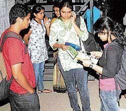 Students come out after appearing for CAT online at a centre in Bangalore on Saturday. DH Photo
