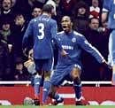 Chelsea's Didier Drogba (right) celebrates with Ashley Cole after scoring against Arsenal on Sunday. Reuters