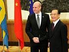 Chinese Premier Wen Jiabao, right, and Swedish Prime Minister Fredrik Reinfeldt, whose country currently holds the rotating European Union presidency, shake hands prior to the EU-China Summit Monday Nov. 30, 2009, in Nanjing, China.AP